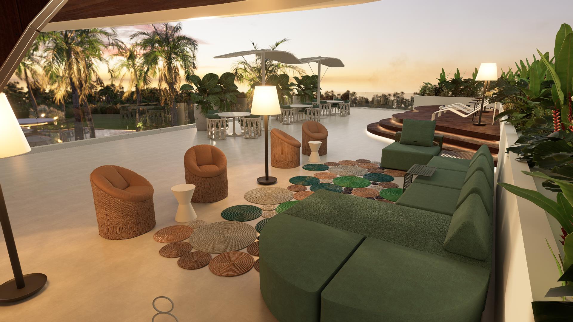 Lounge do rooftop do L'essence ao entardecer, com deck e vista para o paisagismo